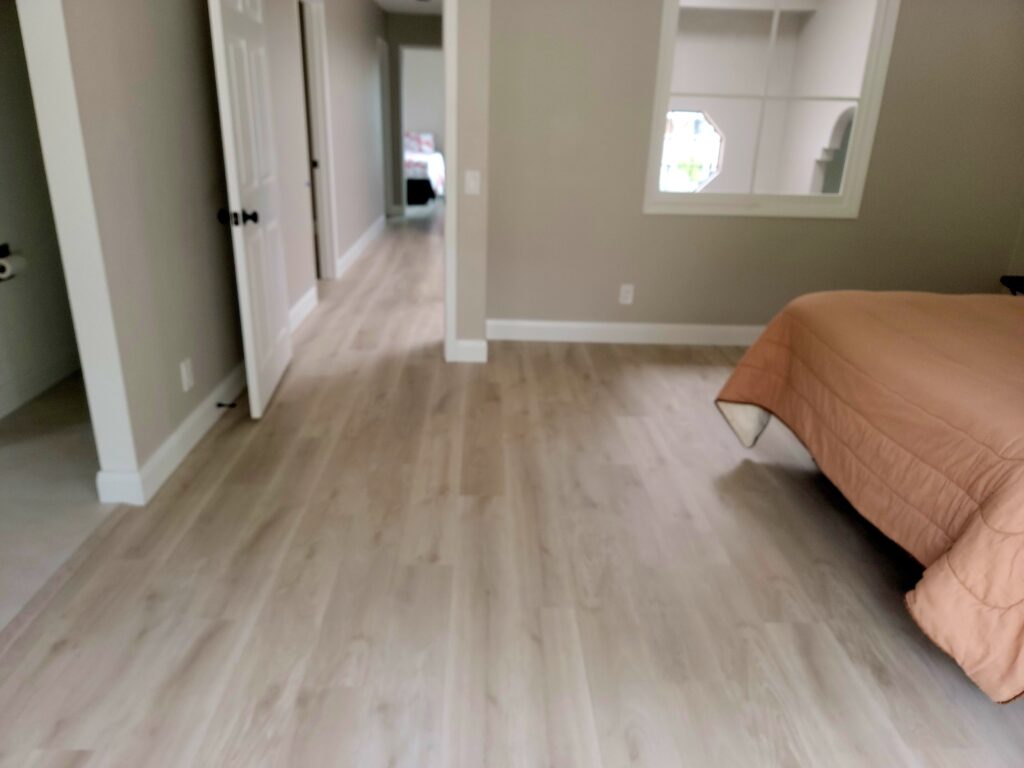 master bedroom after new plank flooring