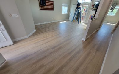 living room after vinyl plank and new baseboards