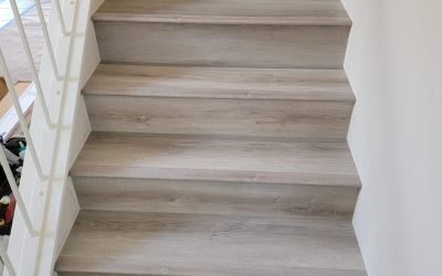 Lower stairs after vinyl plank flooring in Carmel Valley